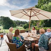 Outside patio with views overlooking the pastureland - Muckrach Country House